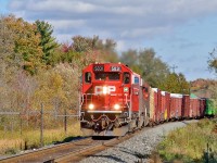 Throttling up to track speed after a <a href=http://www.railpictures.ca/?attachment_id=40772>tail end lift at Wolverton,<a> 235 approaches Begin/End CTC Sign Drumbo on its westbound run.