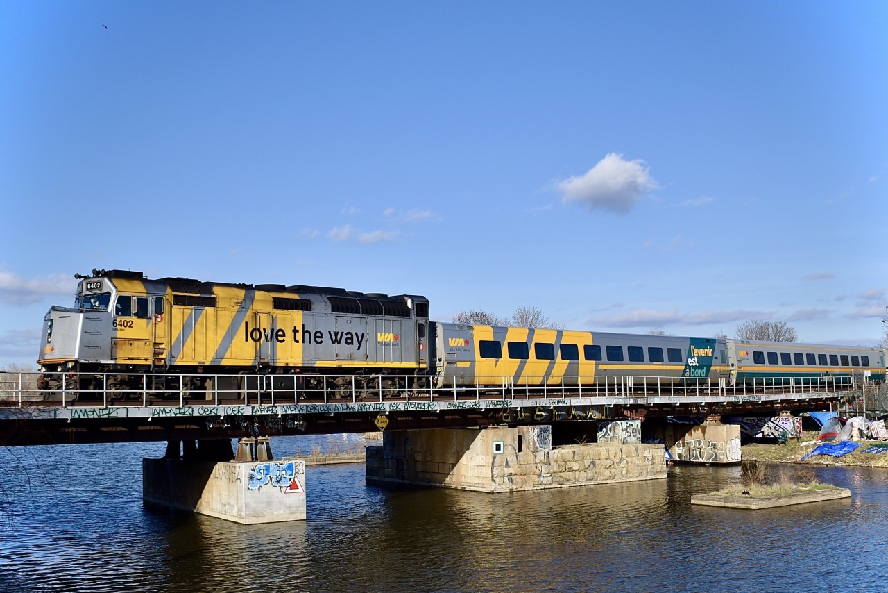 VIA 69 has two wrapped F40s on each end of the train as it is crossing the Lachine canal in Saint-Henri. Wrapped F40s are not as common as wrapped P42s which makes this a sort of rare sight.