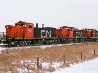 The loads are lifted, coupled back on and it is so long Gibbons as the snow flakes fly. The crews likely last stop now will be Calder yard. This unusual elephant style happened quite frequently with so many of the ex-NAR GMD-1's and GP-9's working the Coronado Sub.