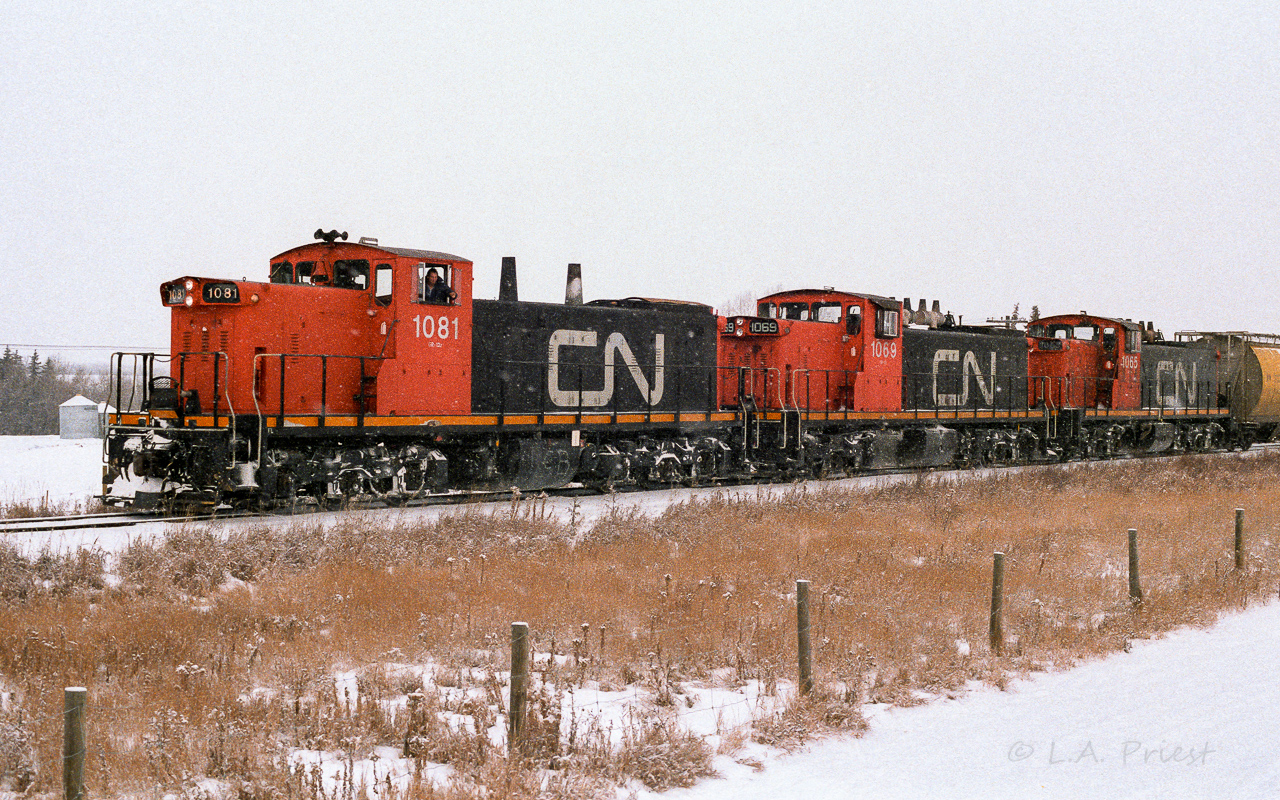 The loads are lifted, coupled back on and it is so long Gibbons as the snow flakes fly. The crews likely last stop now will be Calder yard. This unusual elephant style happened quite frequently with so many of the ex-NAR GMD-1's and GP-9's working the Coronado Sub.