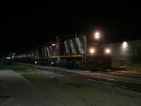 After photographing CN 1439 working Hamilton during March I figured that was likely the last GMD-1 I would photograph as it was the only one remaining in active service in Ontario. This had followed the news that CN had retired all of its Ontario assigned GMD-1’s earlier the same month. And while photos emerged of them still idling away and seemingly still being kept in operating condition at MacMillan Yard, the likelihood of retired units on CN receiving a second chance at service didn’t seem all that plausible. 
<br>
Then on April 21, a photo of CN 1437 surfaced at Kitchener having been set-off by 533 at the yard hours prior. While speculation swirled about the circumstances of this, the reality was CN L540 began using it to switch the yard along with CN 4131 later that afternoon. Then that same night, CN L566 was assigned 1437 and 4131 and headed north to Elmira on the Waterloo Spur with three tankers. Having just missed the train in Uptown Waterloo at 23:15 I was left with a simple choice of going home to bed or continuing the pursuit to Elmira where the only other photos were possible. I mean how often does one get to chase a retired GMD-1 in the dark….as logically this really shouldn’t even be happening in the first place.
<br>
Elmira is an extremely quiet place at night. Even with both chemical  companies purring away the wee hours of the new day, the only sounds heard while I waited for 566 to complete its first set of switching moves, were the flags outside the Lanxess facility flapping impatiently in the chilly night air. Finally at 01:00, 1437’s headlights began inching closer and eventually L566 came to stop beside the Lanxess plant as the crew prepared to uncouple the power and run-around their tankers. With my tripod set-up I clicked away in the darkness hoping to get something as this was the last opportunity to get 1437 leading before it would be coupled to waiting cars at Lanxess. I had time for just four exposures, one seen here, before the crew would runaround and switch ends to 4131, which would lead L566 back to Kitchener. 
<br>
The following night on April 23, CN L566 set-off 1437 in St. Jacobs on their next trip north to Elmira and that same day the Waterloo Central Railway had officially announced that CN had graciously donated the retired but still operational GMD-1 to the organization. While now officially off the CN roster, 1437 has a bright future ahead as it enjoys retirement no longer moving freight, instead future passengers on a spur it can now say it had led its final CN train over. 






