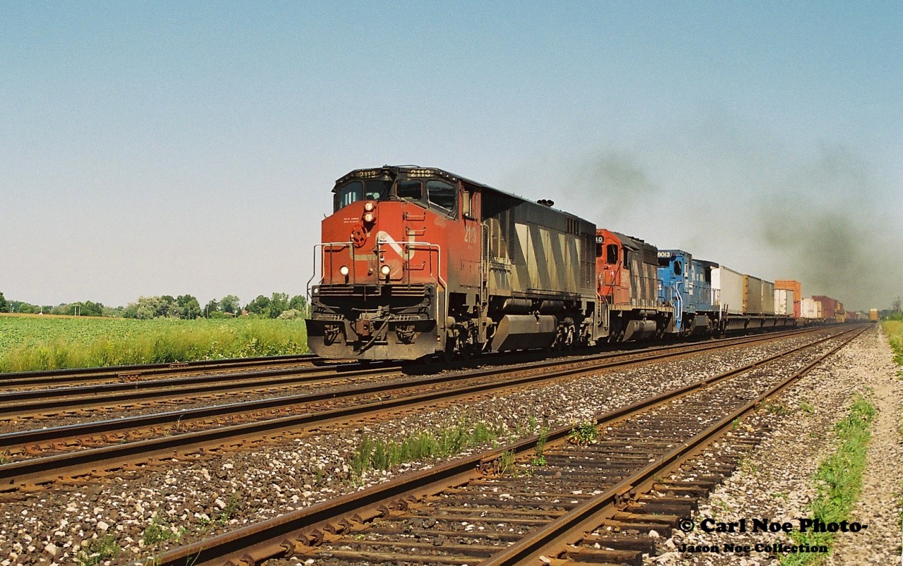 Sounding just as awesome as it looked CN 145 approaches the Nith Road crossing at Paris West with 2113, 5040 and CR 6013 as it heads west towards London on the Dundas Subdivision.