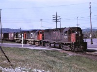Train 215 with 3 C424s for power is shown arriving in Capreol, Ontario on Saturday, May 28 1972.  This train handled mostly piggyback traffic, but was regularly filled out with other westbound cars.  Units are 3209, 3213, and 3214.  The use of 3 C424s/GP35s/GP40s in any combination was common at this time on priority trains before the GP40-2L(W)s arrived in 1974. 