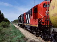 As the headend brakeman walks back to the units after coupling on, I took a moment to catch a shot of the view out of town. By the look of it, you would think we had a lot of trees growing in the area. One of my most fav GP9's, the 4602.