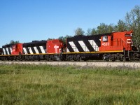 All 3 still looking somewhat fresh from a recent re-painting, they have just entered the south end of the connecting track. A beautiful morning to have the window open and traveling through the countryside. Photo taken at 9:15, east of the Kerensky siding.