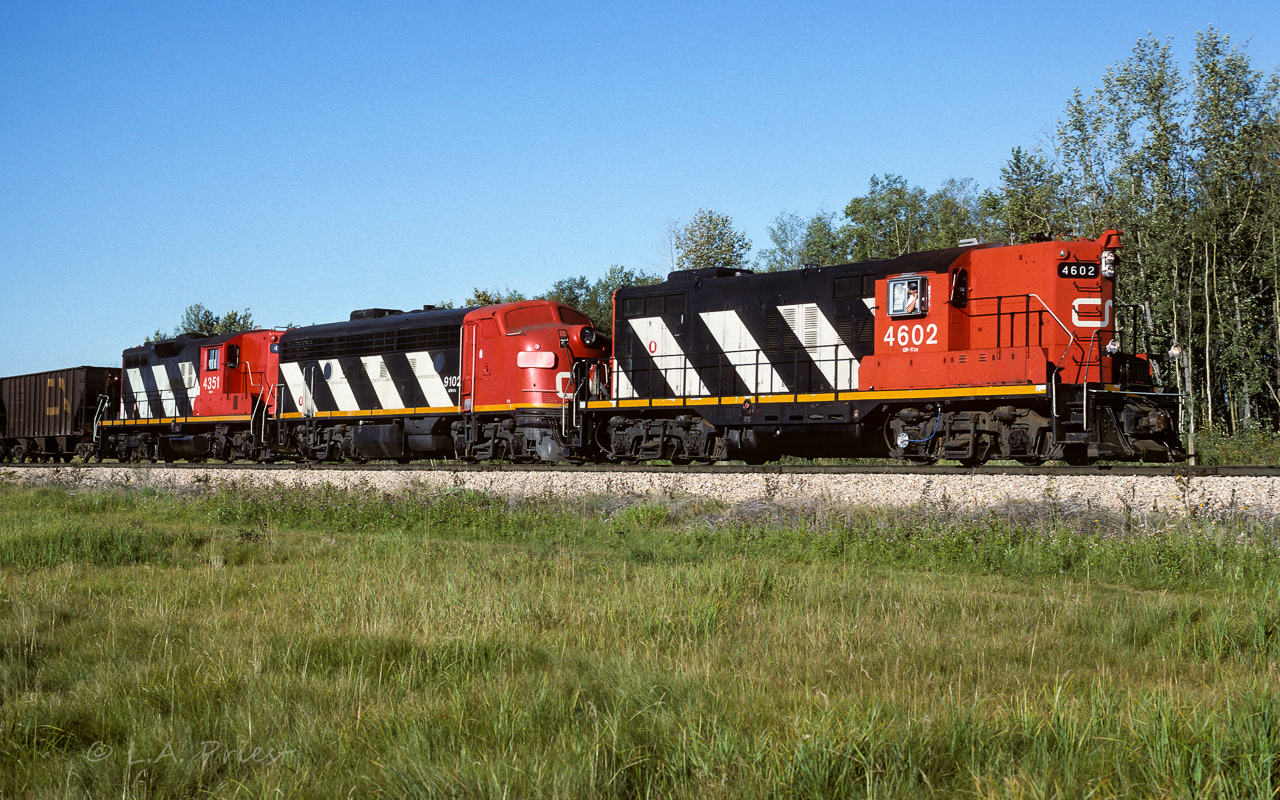 All 3 still looking somewhat fresh from a recent re-painting, they have just entered the south end of the connecting track. A beautiful morning to have the window open and traveling through the countryside. Photo taken at 9:15, east of the Kerensky siding.