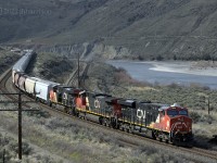 CN 3840 2706 and 2343 are running eastbound along the Thompson River at Basque, on CPs Thompson Sub. In a short distance, the train will connect with CNs Ashcroft Sub, and bypass the town of Ashcroft. 