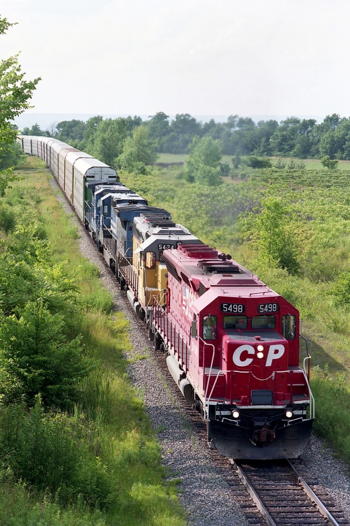 CP's daily train #526, Toronto to USA, pictured here late in the day of July 1st. It would be sundown by the time the train made Niagara, and so......made a short trip to Stoney Creek to catch it.  Lead unit, SD40M-2 5498 is one I rarely saw out on the main line. There were only 10 of these; 5490-5499. (This one was retired in 2007) Other locomotives include CP 5424, in yellow, purchased from GATX, then retired in 2001 and two CR C40-8, 6034 and 6044, both leased from Conrail(out of a total of 28) a couple of months earlier.  At this time, there were something like 230 units leased by CP. For the fans, just amazing.
