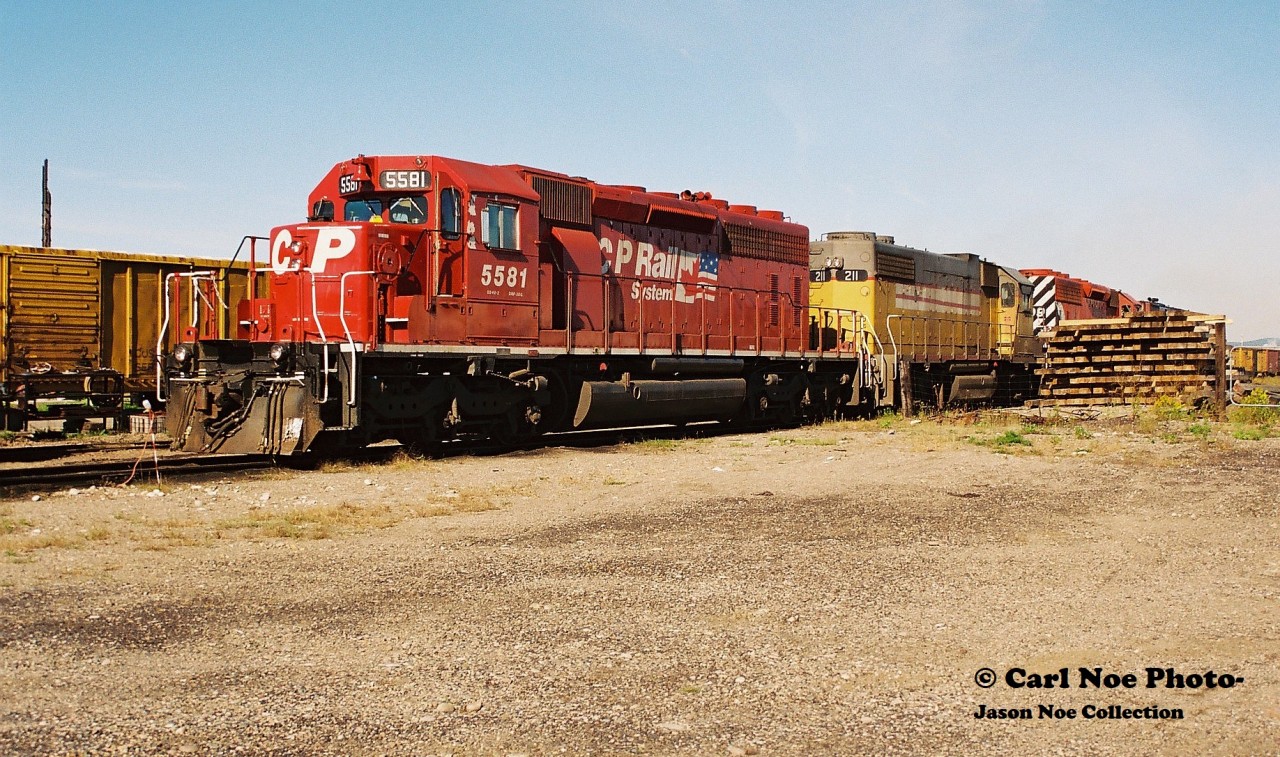 While at first glance it looks like just your average photo of a CP SD40-2 it actually has a little bit of substance as it's the power set of CP 911/ 912 laying over at Sault Ste. Marie which traversed the Webbwood Subdivision. The power includes; 5581, HATX 211, 5609 and 4239 that would eventually depart on 912 for Sudbury later in the day. Not many photos of CP seems to exist in this yard during the 90's as eventually in 1997 the Webbwood Subdivision would be taken over by the Huron Central Railway (HCRY). This was likely due to the sun angles in this yard seemingly being the best within the early morning hours as it was documented here, two years prior to the CP-HCRY takeover.