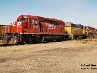 While at first glance it looks like just your average photo of a CP SD40-2 it actually has a little bit of substance as it's the power set of CP 911/ 912 laying over at Sault Ste. Marie which traversed the Webbwood Subdivision. The power includes; 5581, HATX 211, 5609 and 4239 that would eventually depart on 912 for Sudbury later in the day. Not many photos of CP seems to exist in this yard during the 90's as eventually in 1997 the Webbwood Subdivision would be taken over by the Huron Central Railway (HCRY). This was likely due to the sun angles in this yard seemingly being the best within the early morning hours as it was documented here, two years prior to the CP-HCRY takeover.
