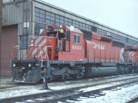 The area around the roundhouse and diesel shop was fairly quiet on the 10th of Dec 1986. This allowed me to wander around a bit. Both sides of the diesel shop were lined with locomotives so I tried to photograph each one separately. When I got to CP 6003 I managed catch it standing alone, and with a cleaner coming out of the cab. I have attaching the photo with cleaner at the cab door because I think it is the most interesting one. 