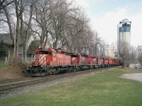 Once again, memories from one of my favourite spots in Niagara. The "South Siding Switch", which now is still in place as Montrose Sub, Chippawa Industrial spur. (The line that used to go thru the Falls area ends here). In this view, CP 5529, 5631, 5421, 5578, 5689 and 8239 head up a train westbound; with Montrose Yard just around the bend behind me... a mile or so.
Times sure have changed. It used to be the Tower that stood out all by its' lonesome. We see the advance of the hotel scene in this image, and I would not be surprised if the tower is now dwarfed and hidden.  Haven't been back lately to check.