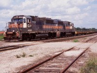 Back in the day CP train 141 was one of those trains a railman could easily get bored of, and the fact it was all empty flat cars often lost in the track side weeds didn't help either. At least opposite train 142 was fully loaded, so much more impressive. As the Alco control cab sets were gradually retired the train got a bit more colourful, often with a mix of GP9's, GP38's and GP40's. For a while the weathered set of former Guilford/B&M 4655 and 4652 held down train 141/142, while ratty by appearance the two were a nice change from CP red. Here 141 has almost finished its climb up the Niagara Escarpment as it cruises through Guelph Jct.