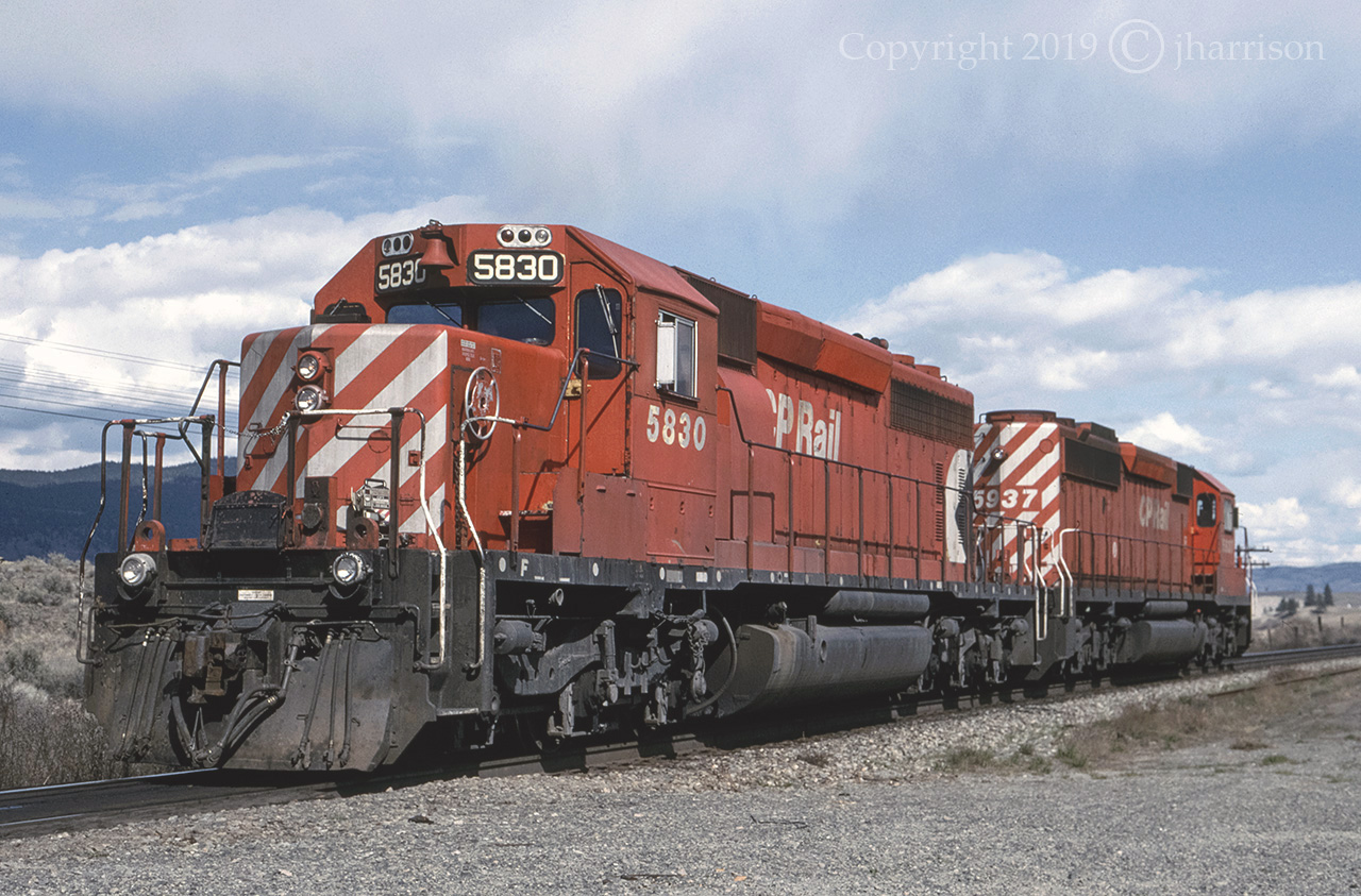 Two SD40-2s, CP 5830 and 5937, taken 26 years ago between Walhachin and Savona at Mile 31.7. If my memory serves me correctly, these units were just sitting there idling away, or ... maybe not:)