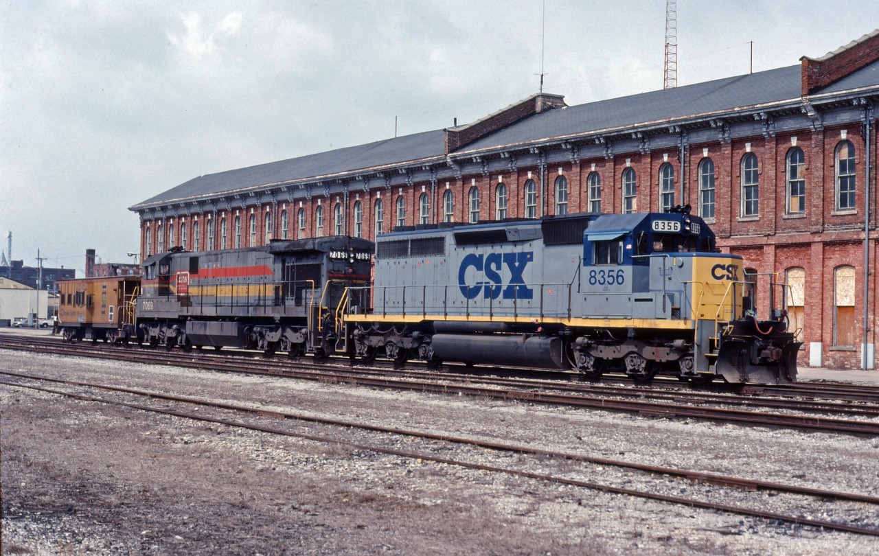 When CSX rationalized its operations in Ontario in the late 1980s, it moved trains west of St. Thomas to the CN-CP owned CASO sub (January 1987) and shut down the Talbot yard and engine servicing in St. Thomas. Traffic was down to one train per day each way circa 1985 and 3 days/week east of St. Thomas (Monday/Wednesday/Friday) circa 1990. You will note in this photo only shows engines 8356 (a former Clinchfield/Seaboard System SD40) and 7069 (a former L&N/Seaboard System C30-7) and a caboose; the Buffalo cars have been left at Fargo (along with cars set off for CSX points on the Sarnia sub) because CN would only allow CSX to use side tracks in St. Thomas in case of emergency.
In 1993, CSX re-configured its operations to run trains 323/322 Sarnia-Detroit via Fargo and 320/321 Chatham- Buffalo. According to Mr. Mercer, it was a 12-14 hour trip to Buffalo. This eliminated the lift/setoff at Fargo and the CSX local dragging cars from Fargo back to Chatham.