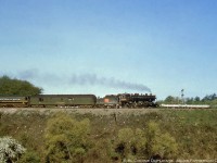 Canadian National Railways N-4-a, 2-8-0, 2525 makes its way eastbound through Bayview Junction with Hamilton - Toronto train 80 (based on sun angle), a daily except Sunday passenger train with Railway Post Office service.  The train departed Hamilton at 0950 with stops at Burlington, Oakville, Clarkson, Sunnyside, arriving Toronto Union at 1110.  CNR 2525, built by MLW in 1906 as Grand Trunk Railway D5 661, would be scrapped in November, 1961.<br><br>In the background the old York Boulevard bridge can be seen. 
 It and the entire Bayview area can be seen here in this <a href=https://digitalarchive.mcmaster.ca/islandora/object/macrepo%3A71739>1958 aerial image archive.</a> 
 In great detail too I might add.<br><br><i>Original Photographer Unknown, Al Chione Duplicate, Jacob Patterson Collection slide.</i>