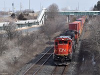 After waiting at Whitby for a VIA train to pass, CN 149 is the first of three halted freight trains to begin moving again. In the lead is 2128, one of the ex-CNW Dash 8s to receive the 15th anniversary logo on the side. Unfortunately, RTC made the last-minute decision to route it on the south track which prevented me from getting it in the shot! Still quite happy with the way this turned out as the sun decided to peek out at the last second.