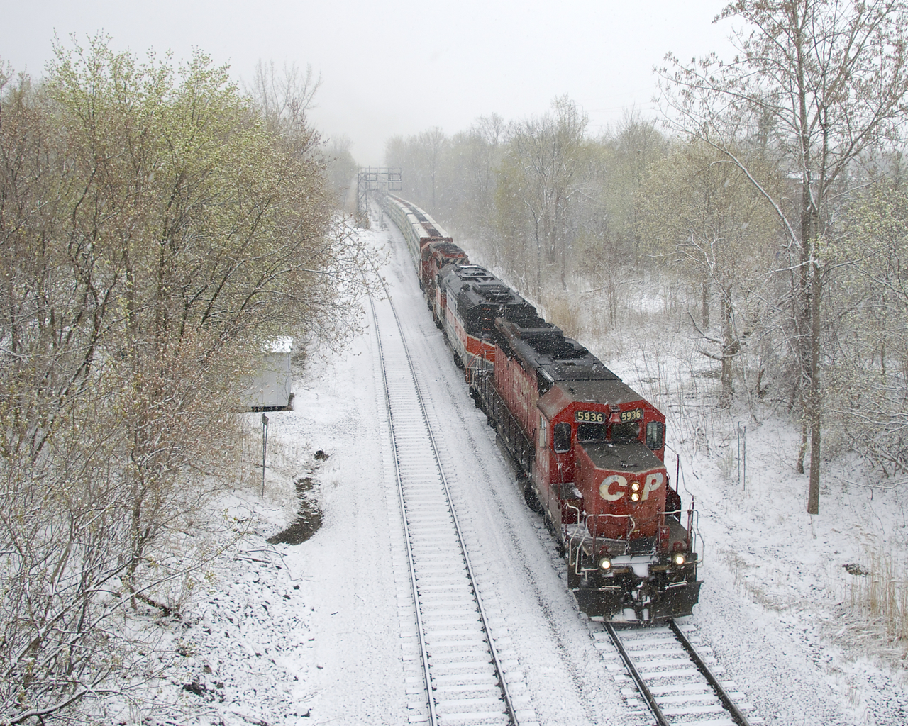 Snow is falling as CP 251 passes North Jct with an all-EMD lashup (CP 5936, CMQ 9017 & CP 6018). CP 251 has gone back to mostly having GE power, so this was a nice surprise. The snow was a not as nice surprise, but it does make for a nice photo.