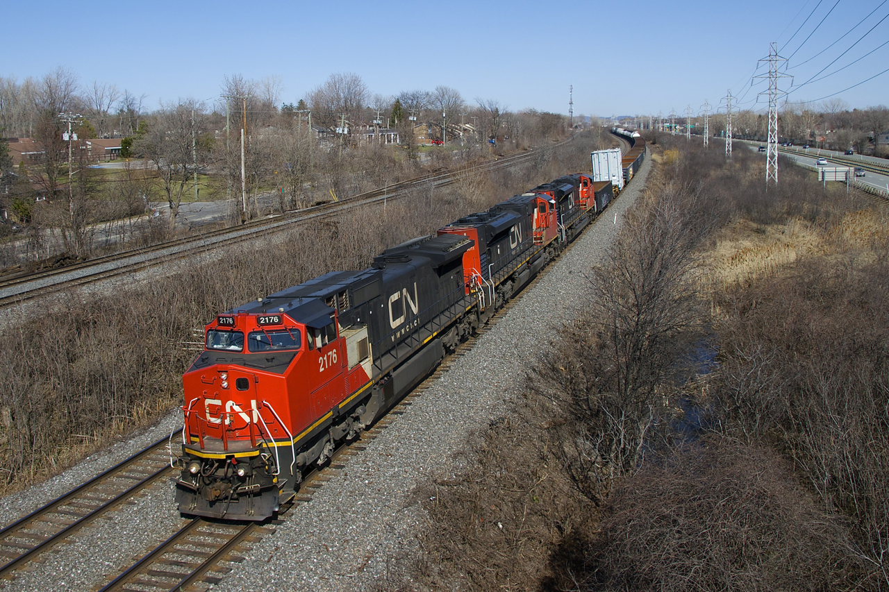 CN 321 has a transformer as the second car (on 8-axle flat QTTX 130567) as it heads west with CN 2176, CN 8011 & CN 8937 for power.