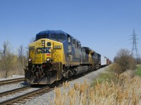 Getting awfully rare, a pair of AC4400CW's still in the YN2 paint scheme (CSXT 485 & CSXT 214) lead a very short CN 327 which has just come off CN's Valleyfield Sub, onto CSXT's Montreal Sub at Cecile Jct.