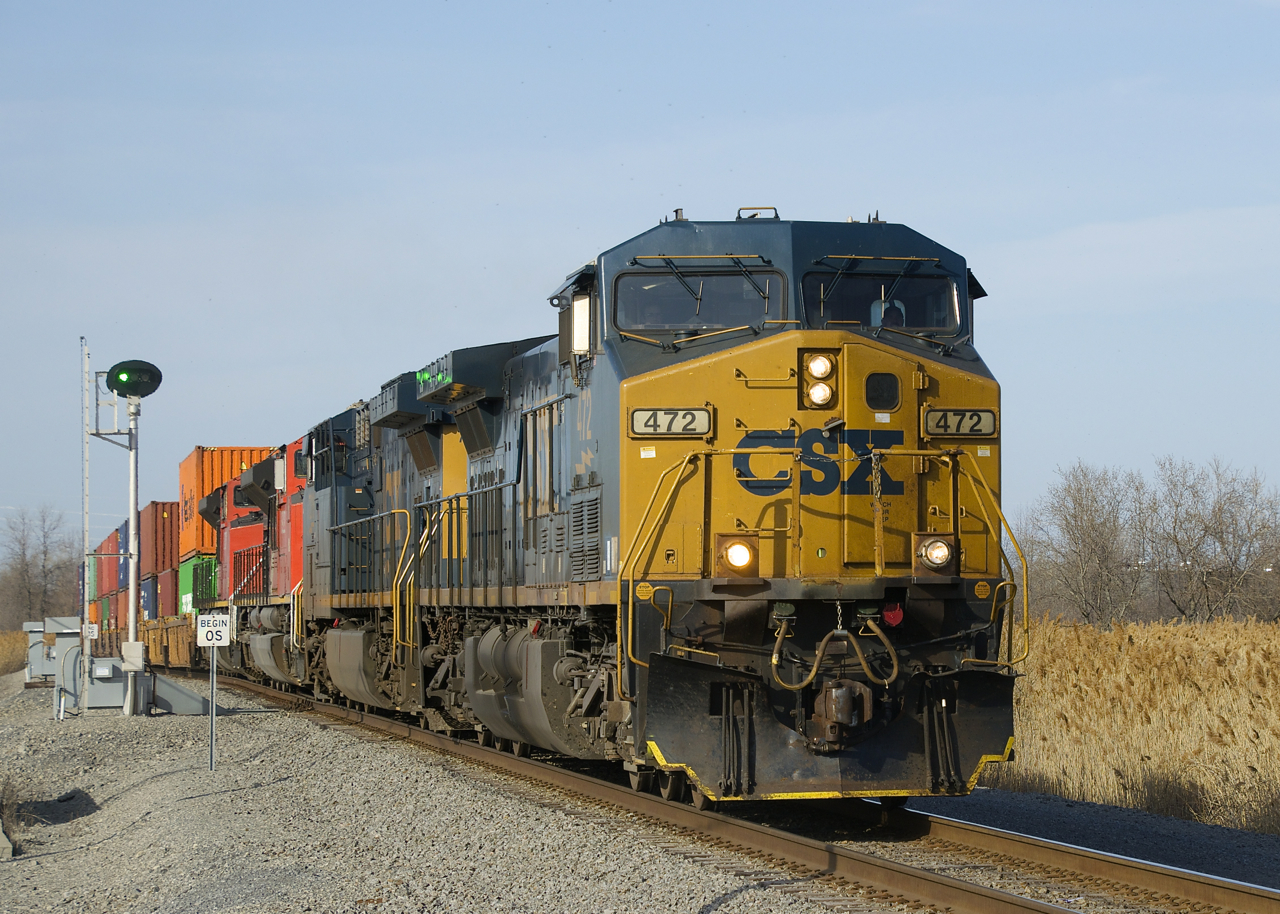 CN 327 is passing a switch point indicator that lets approaching trains know if the switch is lined for the main or for the siding. Power is CXT 472, CSX 7216, CN 8922 & CN 8837.