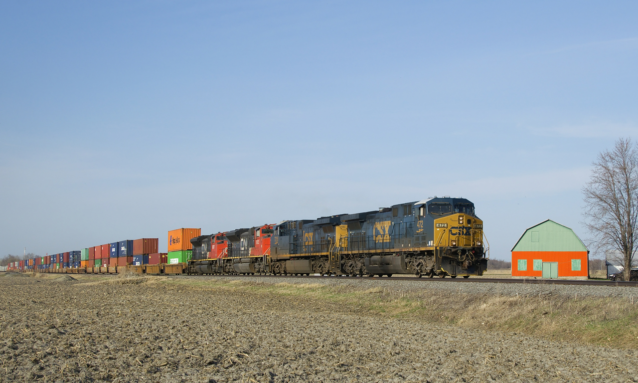 CN 327 has a healthy 45 intermodal platforms up front as it heads south with a mixed bag of CSX and CN power (CXT 472, CSX 7216, CN 8922 & CN 8837).