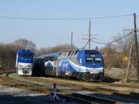Two Saint-Jérôme line trains meet as AMT 1368 leads EXO 178 towards Montreal West Station as the consist for EXO 174 heads towa