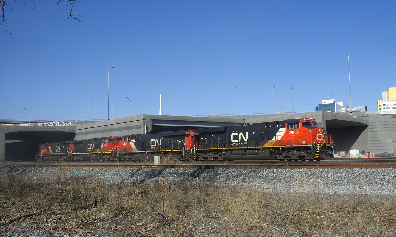 CN 120 has 5 units (CN 2968, CN 2815, CN 2200, CN 2122 & CN 4700) as it exits a tunnel under the rebuilt Turcot interchange with a shorter than usual train (392 axles).