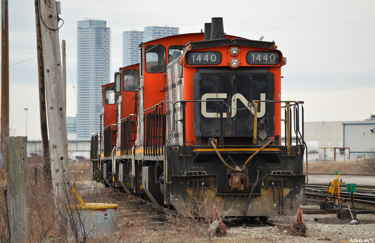 While 1439 is still working hard in Hamilton, 5 of it's counterparts have found themselves "retired" at Mac Yard with these 3 (1440/1408/1412) sitting on the South side of the shop smartstarts chirping away (not running but batteries are charged) with fuel in tanks. Meanwhile on the North side, 1444 and 1437 are running but haven't moved in a few weeks. None have stacks capped, yet...Taken by an off duty CN employee wearing all required PPE.

 Uploaded ID#45064 in error, meant to upload this file instead. Please delete 45064 and consider this one submitted instead. Please delete this text as well, thank you!