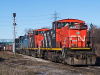 On what seemed to be the only nice weather day of the entire Christmas Break, I found myself standing on Gage Avenue waiting on the passage of the CN 0700 yard job behind CN 1444, CN 1408 and GTW 5849.  