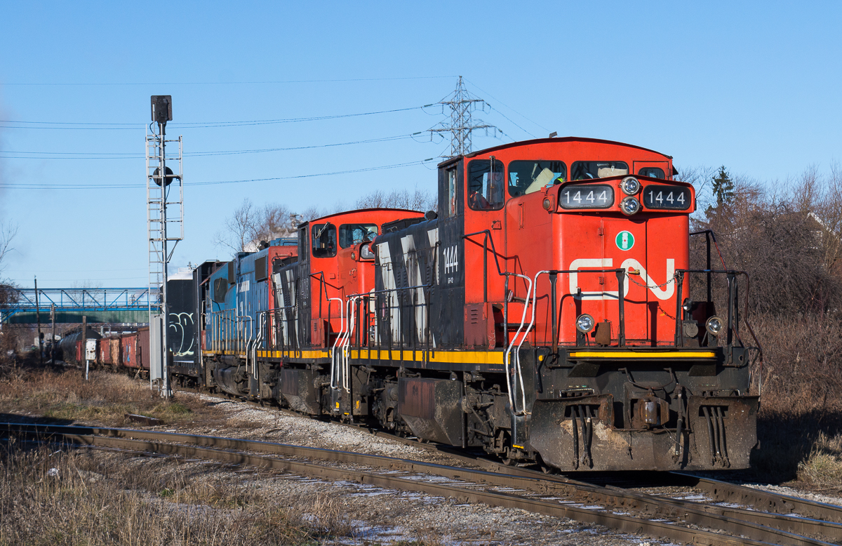 On what seemed to be the only nice weather day of the entire Christmas Break, I found myself standing on Gage Avenue waiting on the passage of the CN 0700 yard job behind CN 1444, CN 1408 and GTW 5849.