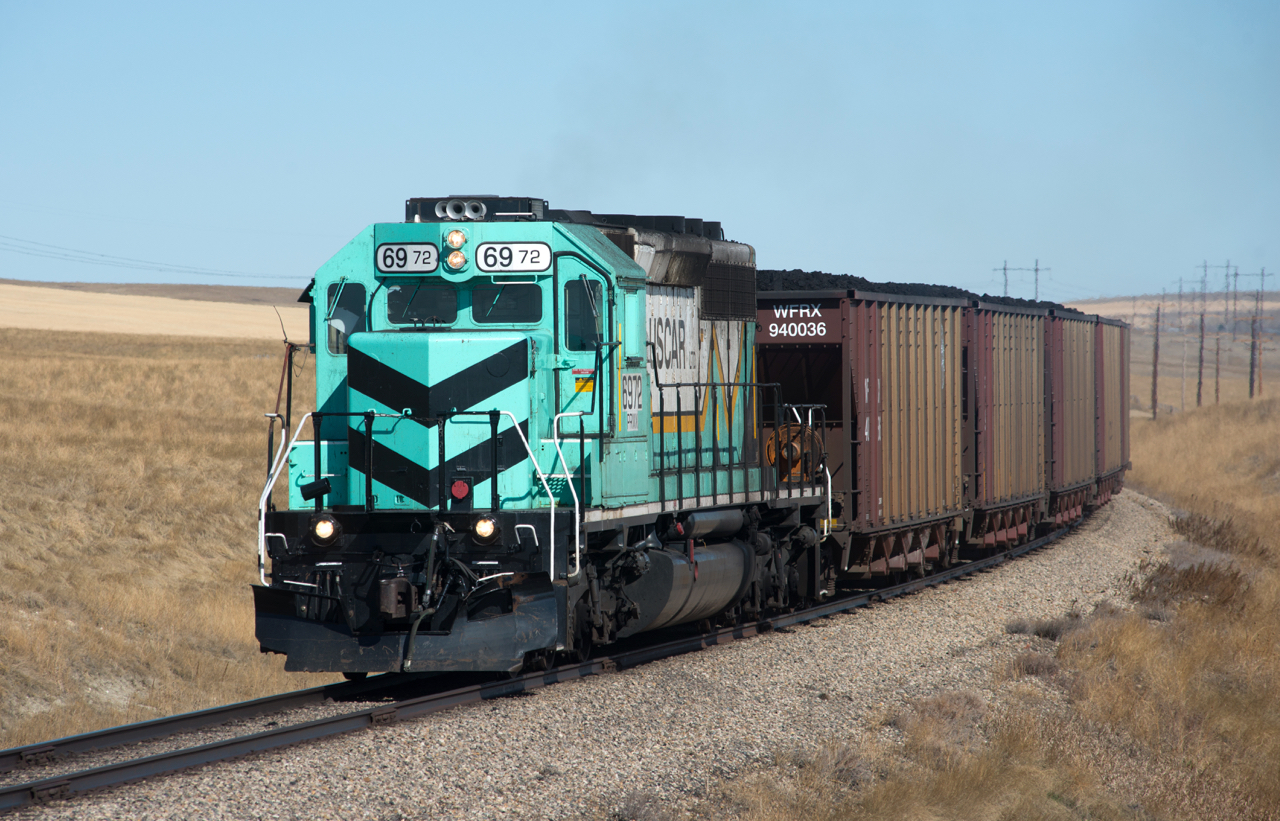 PRMX 6972 is seen heading south from Westmoreland's Poplar River Mine to Saskpower's coal fired plant just outside Coronach SK with the first coal load of the day. I am hard pressed to think of any other active railways in Canada that exist for the sole purpose of transporting coal from mine to power plant. Are there any others ?