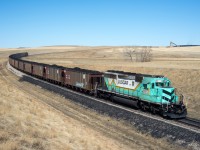 PRMX 6972 is seen departing Westmoreland coal mine just north of Coronach Saskatchewan with a train of recently acquired exBNSF hoppers. 