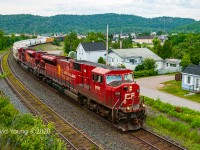 Toronto to Winnipeg manifest accelerates out of the crew change point in Schreiber with consecutively numbered SD90MAC's 9101-9102. If you look closely above the fifth and sixth car from the headend, you might be able to pick out the top of some maroon looking equipment. The Royal Canadian Pacific was in town on Day 2 of a 3 day excursion giving rides to CP employees on the Nipigon and Heron Bay subs in celebration of CP's 125th anniversary.