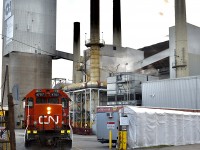 CN L596 switches the Owen-Illinois glass industry using a rarely used spur. It is seen here dropping off the loaded sand cars at the factory.