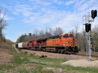 I got a text from a fellow railfan saying CP 254 was lined down the Hamilton sub. I had little to zero interest in going anywhere to see that same old same old. Unlike other times, this was a Monday so CP 254 usually goes down and back up the same day. Earlier in the day, BNSF 5479 was actually leading CP 244 which terminated so all thoughts of it coming were gone. I can hear CP254 blowing for the crossings at Emerald Lake and the Seventh concession and my grandson wanted to go see it. I get another text saying the BNSF is leading CP 254. Off we go and I know I have no chance to catch it on the Galt sub, so this spot, at this time of day is a beauty. Here BNSF 5479 with CP 8935 head down the Hamilton sub at mile 75.1 with a clearance to Welland. Fresh new ties, fresh new ballast and a slow order made this an easy chase down.