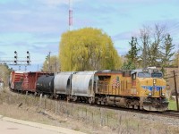 Shades of spring yellows are alive as UP Gevo 8055 passes a large willow tree coming alive east of Streetsville yard. The train has just finished working Hornby yard and is back on the move again, heading for Toronto.