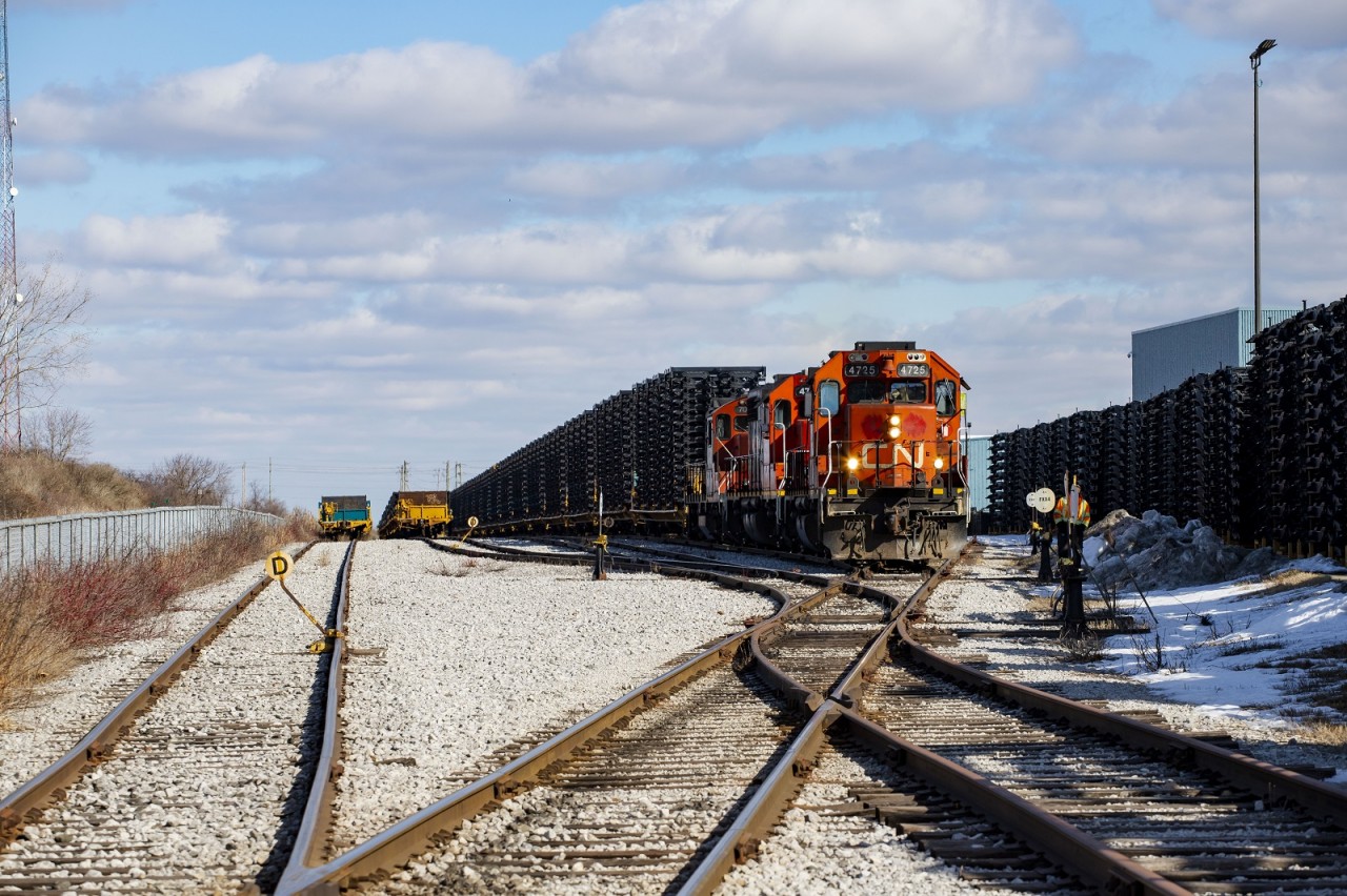 CN L583 assembles their train of frame flat cars in the small yard at Formet Industries in St Thomas.