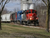 CN L540 has just crossed Queen Street in Kitchener on the Huron Park Spur. CN 4125, GMTX 2284 and CN 7081 are hauling a lengthy train to the interchange with Canadian Pacific. April 5, 2020. 