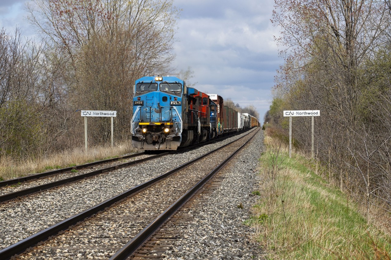 CN A439 splits the station signs at Northwood as they head west towards Windsor. An increasingly rare "Blue Devil" was assigned to this run for about 2 weeks giving many opportunities for chasing. A much more common Blue Jay can be seen flying next to the left Northwood sign.