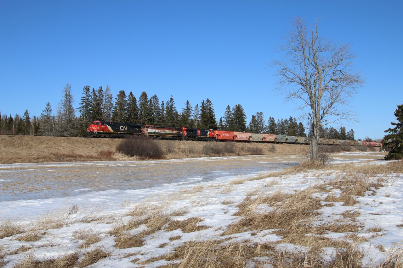 A colorful consist leads some potash cars and mixed freight passing mile 5 on the Sussex Sub heading to Saint John.