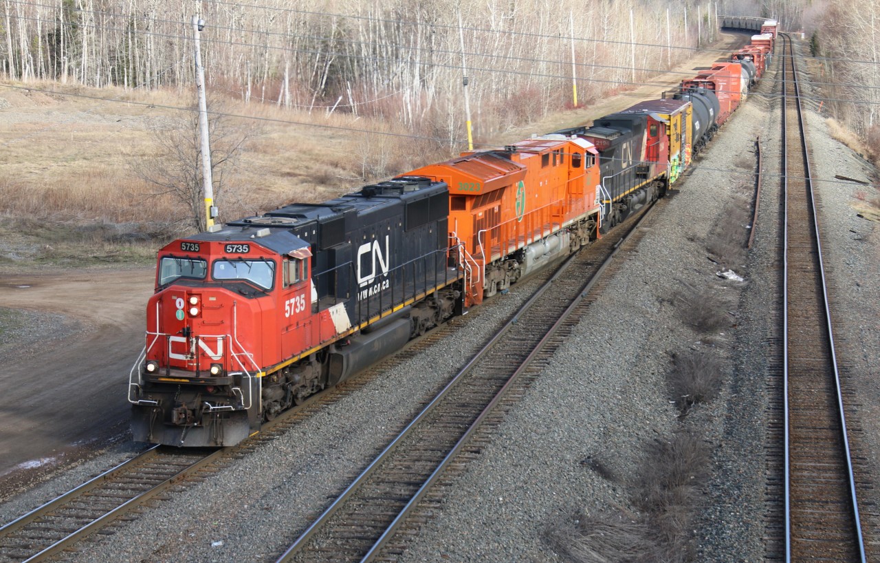The J heritage locomotive arrives at Monctons Gordon Yard sandwiched between 2 units on it's first trip to the East coast.
