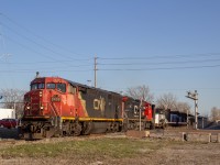 Cn 438 rolls down with a cool, Cowl leader entering the wye to the Via Chatham sub 