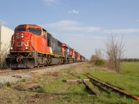 Cn 438 slowly creeps by the Cn Pelton spur where the tracks are getting repaired 