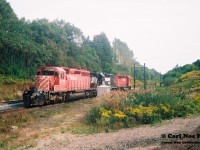 Norfolk Southern train 328 from St. Thomas heads east light power down the hill at Copetown on the Dundas Subdivision with CP 5587, NS 2766 and CP 5568. At the time, the Inksetter Road bridge was undergoing a complete overhaul and was completely removed over the CN mainline.
