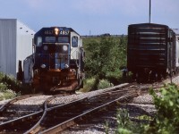 I have always love the New England railways, especially prior to Guilford. Unfortunately as a kid I never took any photos on any family trips. When Guilford returned a number of ex B&M GP40-2's to their leasing company at least one remained in B&M blue. As luck would have it CP picked up a number of them from Helm leasing in the late 1990's, and 4657 arrived in well weathered B&M blue. Unfortunately it did not last long and I only caught it one in its old blue paint before receiving fresh CP paint. Back then both industries north of highway 401 received rail service, and the warehouse on the east side of the line had a decent grade on it, as can be seen here as GP40-2 4657 hauls a cut of cars up the grade. The boxcar to the right is one of CP's former PL&E 50 footers once so common. Today the warehouse has been sold and while the rails remain it no longer receives rail service and by years end the OBRY will likely no longer pass by here either. 