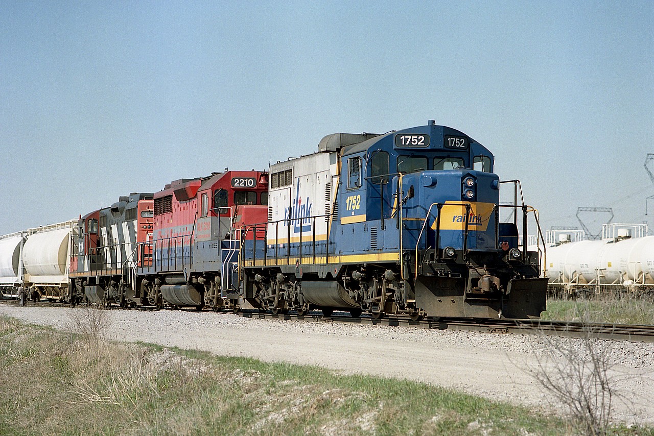 I have to admit I soon lose track of who owns what when it involves these shortline companies. I am thinking that in 2002, when this image was shot; RailAmerica was the owner, but file it under Railink account of the leader here. It is a nice set of colour: RLK 1752, RA 2210 and CN 4104 (leased?) noted as the train builds for Nanticoke. The 1752 was scrapped in 2008.