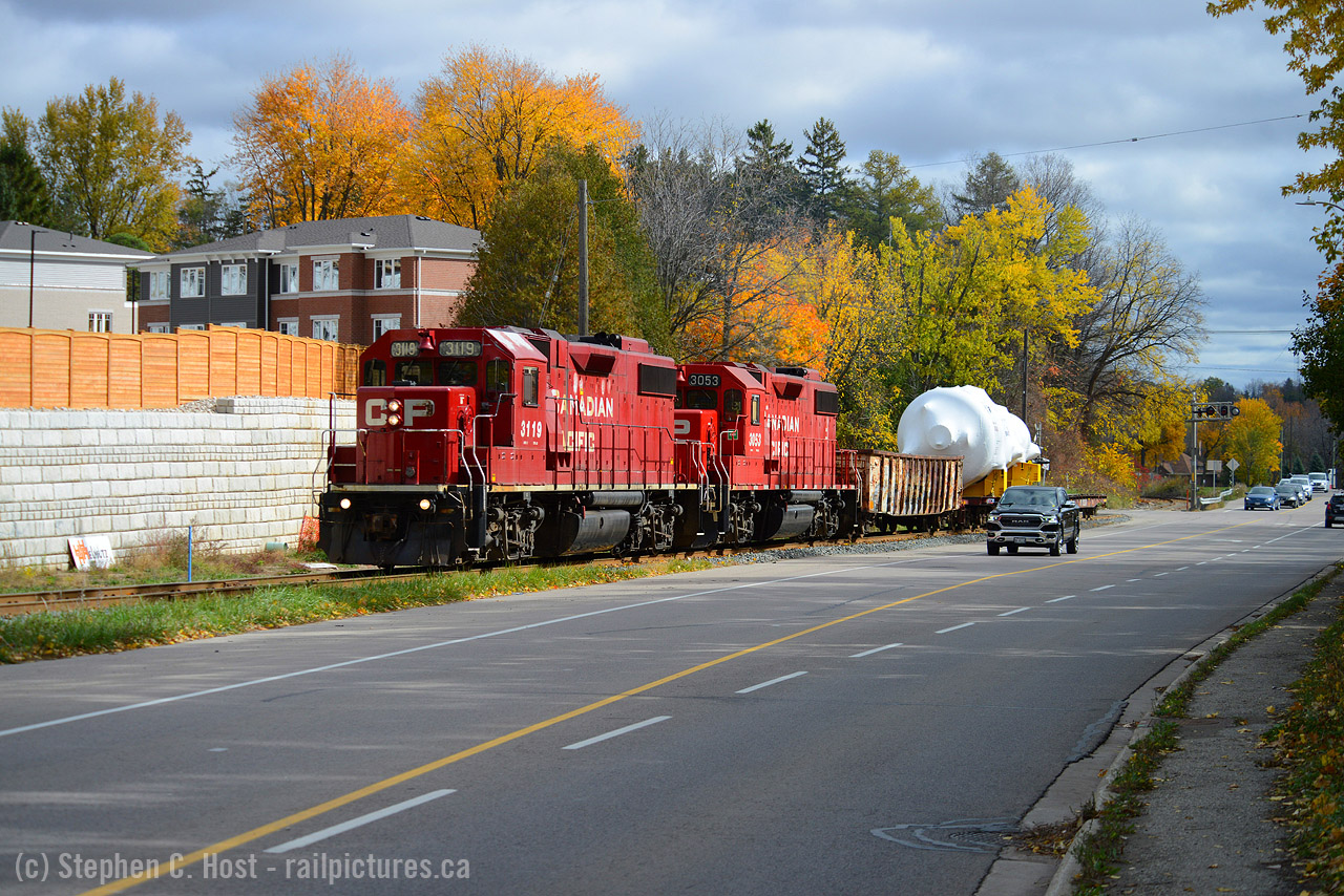 With interurban roots, the Grand River Railway runs alongside King St between Freeport and Parkway in Kitchener. Imagine my surprise to chance on this move while out for a drive, and on an otherwise cloudy day, getting sun where it counts the most. This dimensional which in years past would have been moved GEXR/CN is going CP to the CNR interchange in Kitchener, then over to Goderich on GEXR via CN. For more on the Grand River Railway/LE&N get a copy of "Steel Wheels along the Grand" by George Roth from your local library. Copies are very hard to come by for sale.