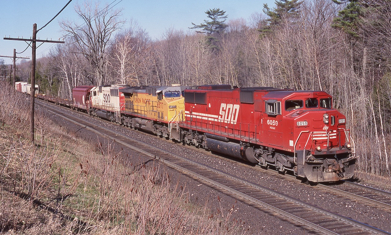 One of the most interesting trains for motive power back in the day was 243. This day it certainly had a nice mix as the train digs into the last mile or so of the climb up the Niagara Escarpment.