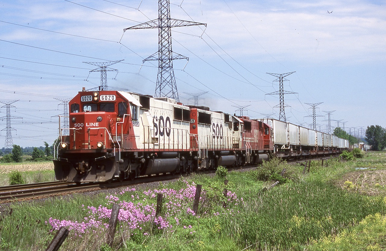 For a young railman, these were the days. I didn't see much SOO Line early on but certain trains like 501 and 511 were very good candidates for SOO power, and after the IMRL spin off 511 was a good option for IMRL run through power. For years Hornby was my go to spot for CP as trains stormed out of the dip and working in Milton for over 20 years certainly helped too. It was a good spot for aviation fans as well, often catching planes on final approach for the north runway at Pearson, such as in this photo if you look closely. It is sad that the nice wide open shot here has been destroyed by urban sprawl but I'm glad I spent lots of years shooting here. This is probably my favourite shot from 5th Line even with the power lines in the background, the nice spring flowers and a trio of SOO SD60's totally made the shot. I miss all that SOO power, could sure use it these days. The SD60's were always a nice treat to catch, it is so rare to catch them around here these days, especially in sets.